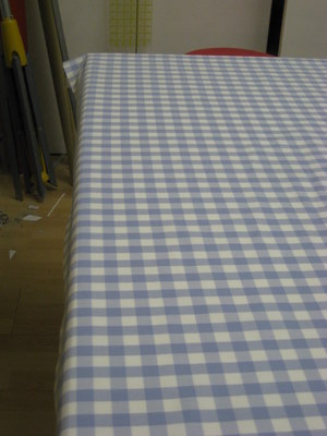 Off grain check fabric before being worked on 